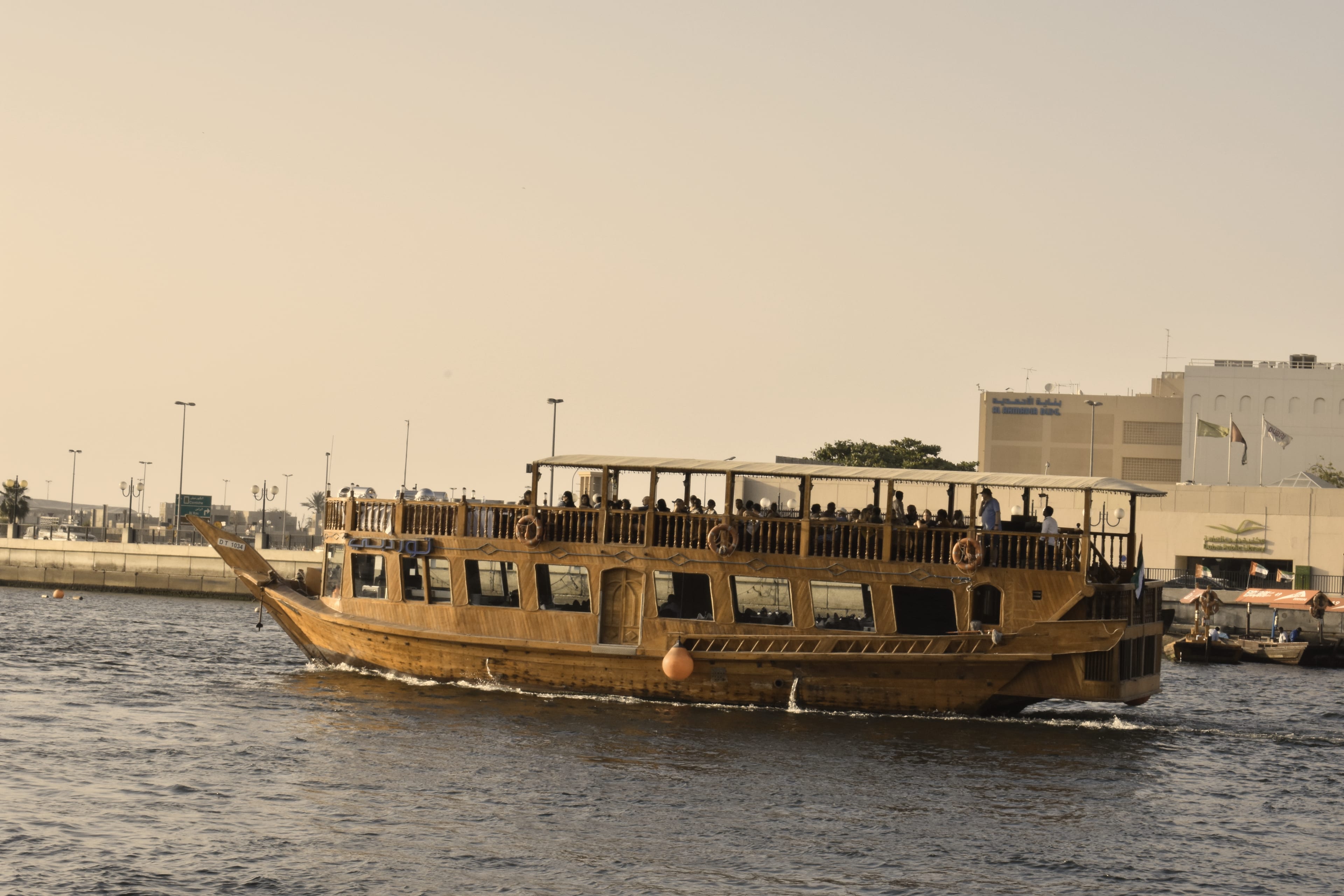A wooden dhow sailing on Dubai Creek